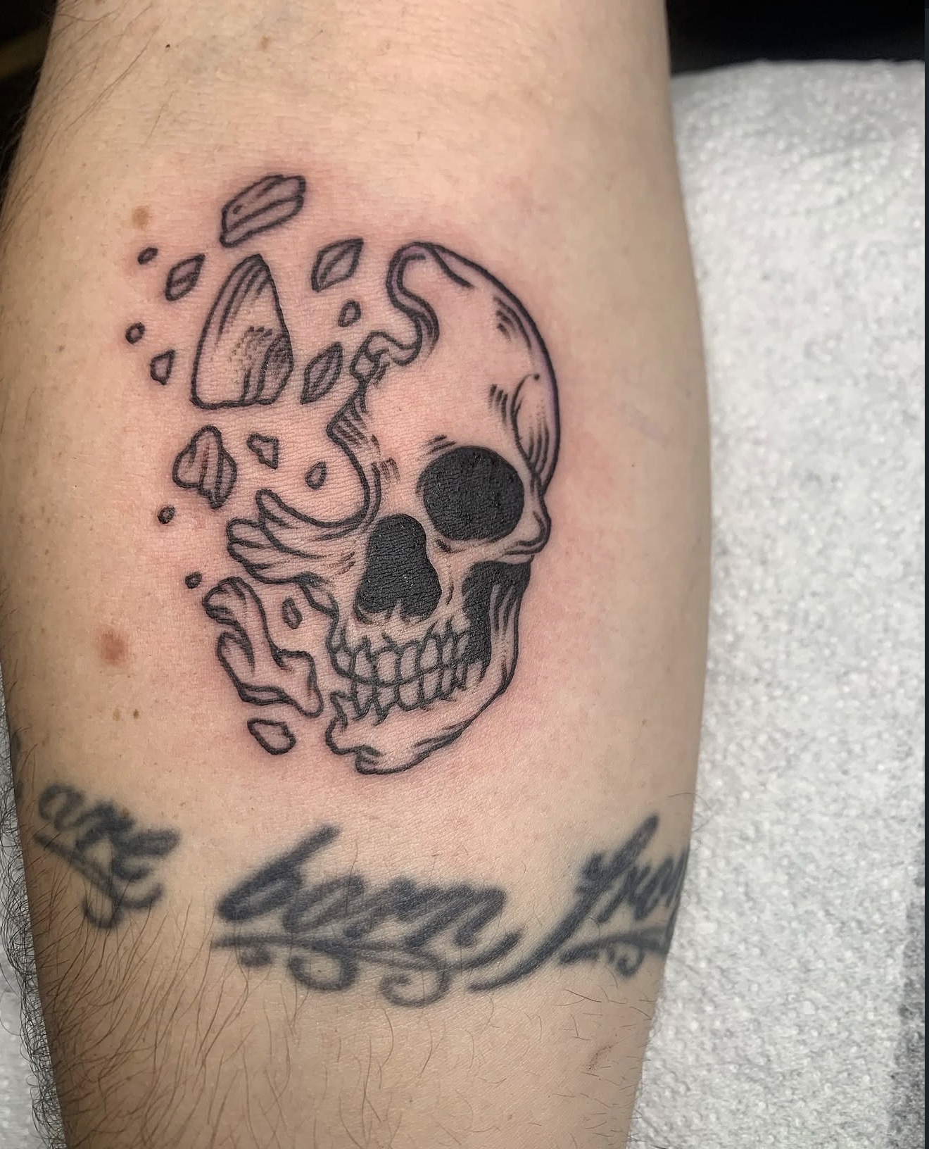 Crumbling skull, forearm