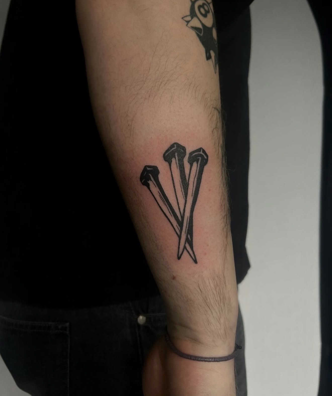 Crossed nails, forearm